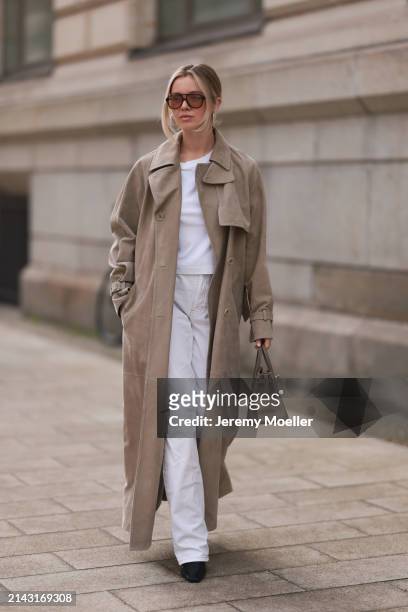 Isabelle Hartmann seen wearing Corlin Eyewear brown sunglasses, COS white cotton basic t-shirt, Max Mara beige suede leather oversized trenchcoat /...