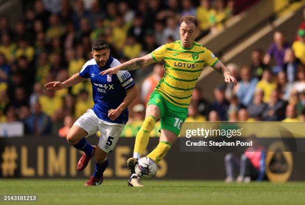 Ashley Barnes of Norwich City controls the ball under pressure from Sam Morsy of Ipswich Town during the Sky Bet Championship match between Norwich...