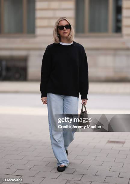 Isabelle Hartmann seen wearing Celine black sunglasses, Almada Label black cashmere wool knit sweater, Levi’s light blue vintage denim, Hermès Birkin...