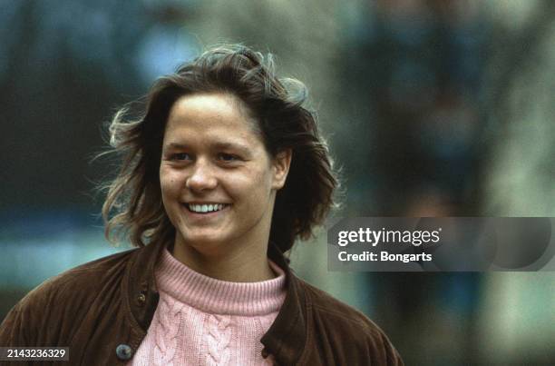 German swimmer Sandra Volker wearing a brown suede jacket over a pink cable-knit sweater, March 1992.