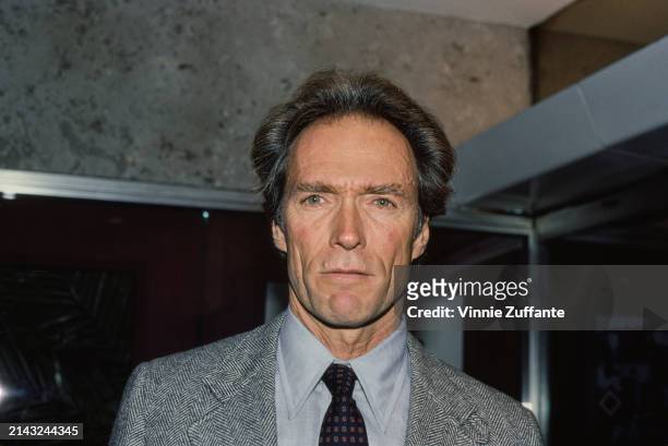 American actor and film director Clint Eastwood, wearing a grey tweed blazer over a light blue shirt and a dark blue patterned tie, in New York City,...