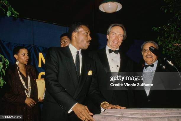 American actor and comedian Arsenio Hall and American actor and film director Clint Eastwood on stage at the 21st Annual NAACP Image Awards, at the...