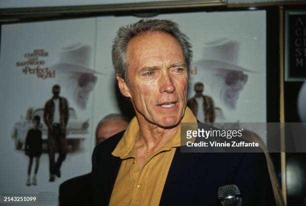 American actor and film director Clint Eastwood, wearing a dark blue blazer over a yellow shirt, attends the Westwood premiere of 'A Perfect World'...