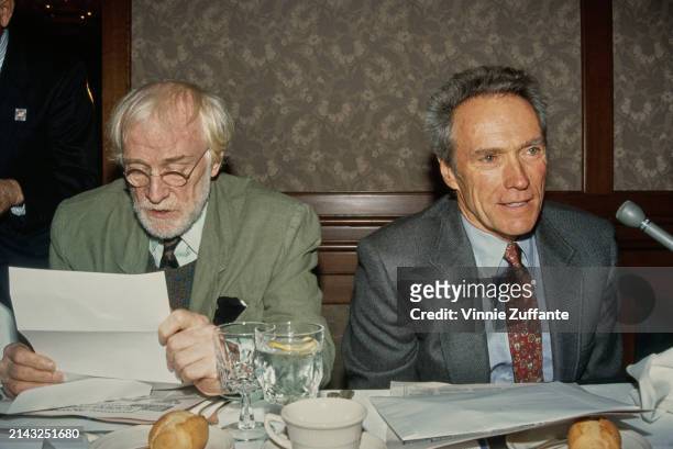 Irish actor Richard Harris, wearing a pale green jacket over a sweater, shirt and tie, and American actor and film director Clint Eastwood, who wears...