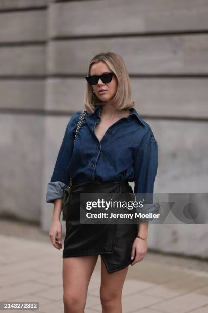 Isabelle Hartmann seen wearing Celine black sunglasses, Closed dark blue denim buttoned shirt, By Aylin König black leather short skirt and Chanel...