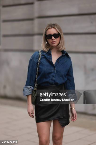 Isabelle Hartmann seen wearing Celine black sunglasses, Closed dark blue denim buttoned shirt, By Aylin König black leather short skirt and Chanel...