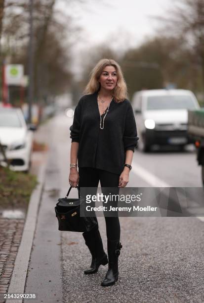 Yasmin von Schlieffen-Nannen seen wearing Chanel gold / pearl necklace, Khaite dark grey wool cardigan jacket, Lululemon black legging pants, Hermès...