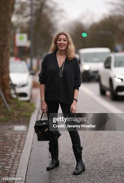 Yasmin von Schlieffen-Nannen seen wearing Chanel gold / pearl necklace, Khaite dark grey wool cardigan jacket, Lululemon black legging pants, Hermès...