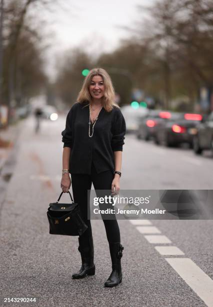 Yasmin von Schlieffen-Nannen seen wearing Chanel gold / pearl necklace, Khaite dark grey wool cardigan jacket, Lululemon black legging pants, Hermès...