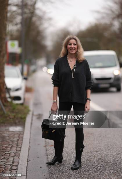 Yasmin von Schlieffen-Nannen seen wearing Chanel gold / pearl necklace, Khaite dark grey wool cardigan jacket, Lululemon black legging pants, Hermès...