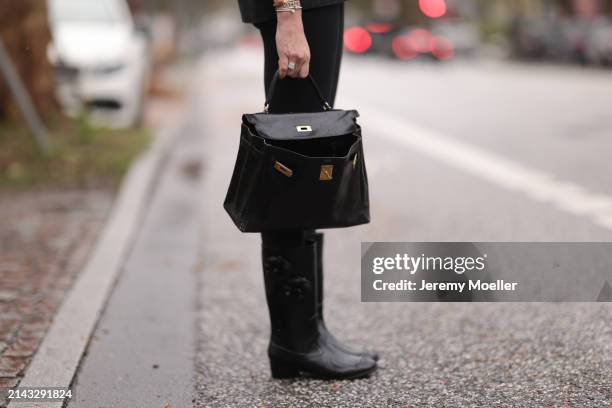 Yasmin von Schlieffen-Nannen seen wearing Lululemon black legging pants, Hermès Kelly black leather bag and Chanel black rubber boots on April 05,...