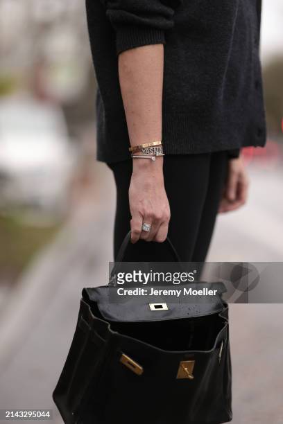 Yasmin von Schlieffen-Nannen seen wearing Cartier gold Love bracelet, Khaite dark grey wool cardigan jacket, Lululemon black legging pants and Hermès...
