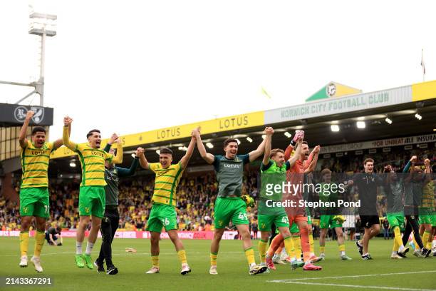 Norwich City players celebrate following the team's victory in the Sky Bet Championship match between Norwich City and Ipswich Town at Carrow Road on...