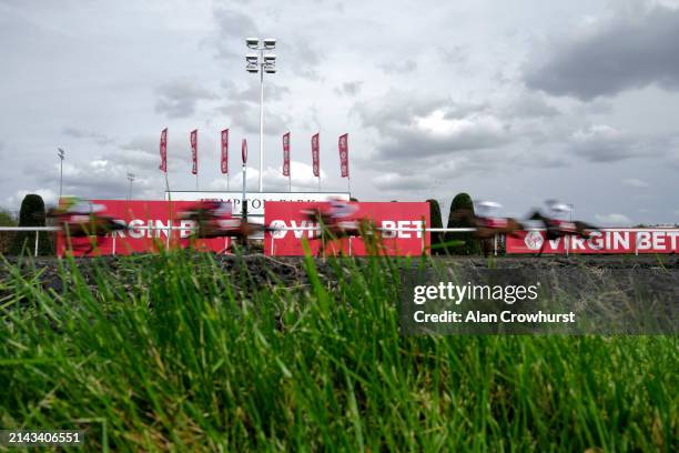 Runners pass the winning line with a circuit to go during The Virgin Bet Every Saturday Money Back Rosebery Handicap at Kempton Park Racecourse on...