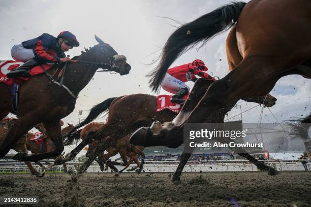 General view as runners pass the grandstand on the first circuit during The at Kempton Park Racecourse on April 06, 2024 in Sunbury, England.