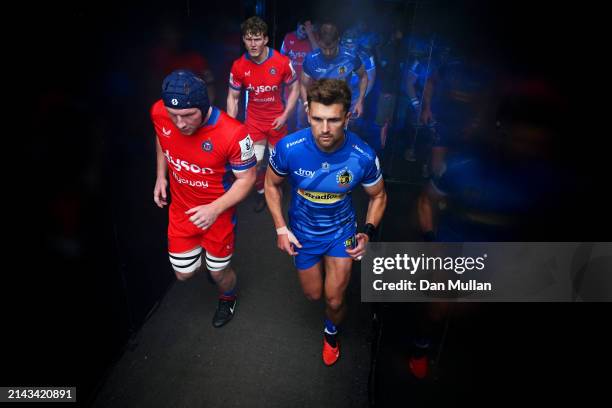 Sam Underhill of Bath Rugby and Henry Slade of Exeter Chiefs walk out prior to the Investec Champions Cup Round Of 16 match between Exeter Chiefs and...