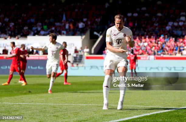 Harry Kane of Bayern Munich celebrates scoring his team's first goal during the Bundesliga match between 1. FC Heidenheim 1846 and FC Bayern München...