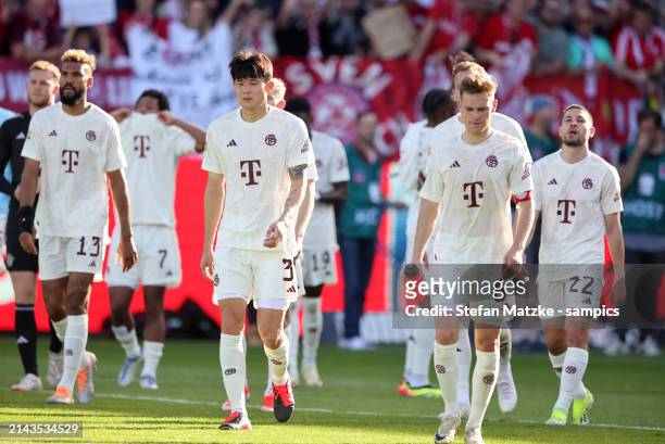 Joshua Kimmich of Bayern Muenchen and Min Jae Kim of FC Bayern Muenchen look dejected following defeat in the Bundesliga match between 1. FC...