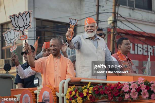 Prime Minister Narendra Modi greets supporters at a roadshow on April 06, 2024 in Ghaziabad, Uttar Pradesh, India. India's 2024 general election is...