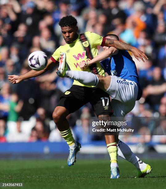 Lyle Foster of Burnley battles for possession with Vitaliy Mykolenko of Everton during the Premier League match between Everton FC and Burnley FC at...