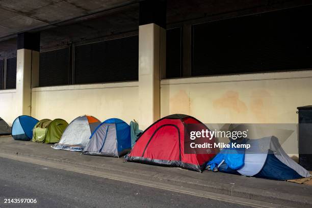 Homeless persons tents pitched in line on the pavement in an underpass near Blackfriars in the City of London on 8th April 2024 in London, United...