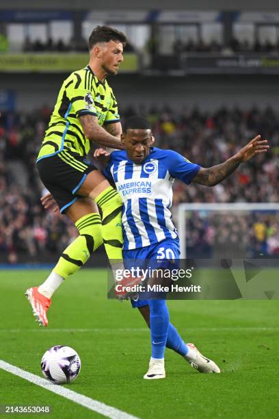 Ben White of Arsenal fouls Pervis Estupinan of Brighton & Hove Albion during the Premier League match between Brighton & Hove Albion and Arsenal FC...