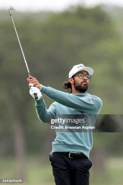 Akshay Bhatia of the United States plays his second shot on the 1st hole during the third round of the Valero Texas Open at TPC San Antonio on April...