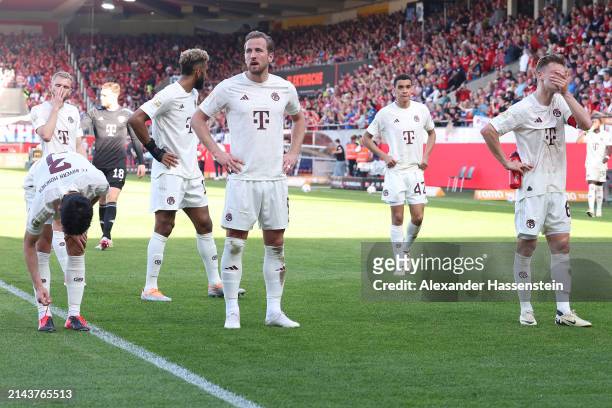 Harry Kane and Joshua Kimmich of Bayern München look dejected following defeat in the Bundesliga match between 1. FC Heidenheim 1846 and FC Bayern...