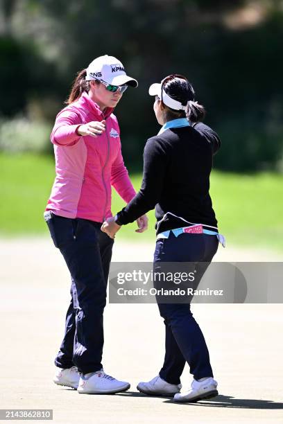 Leona Maguire of Ireland embraces Moriya Jutanugarn of Thailand after winning her quarterfinal match 4&3 on day four of the T-Mobile Match Play...