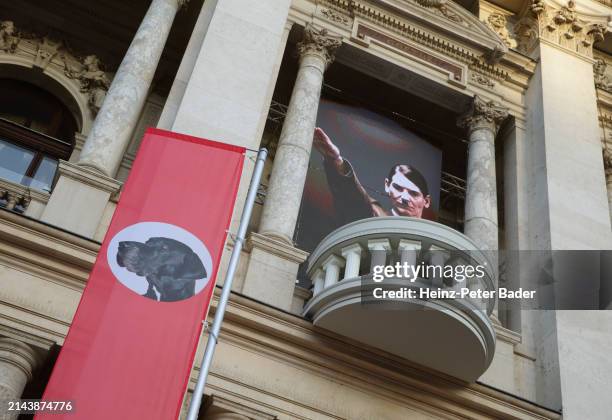 Red flag with a dog's head on it is placed in front of Burgtheater theatre during an installation by Austrian artist Flatz called "Perlenrede" ,...