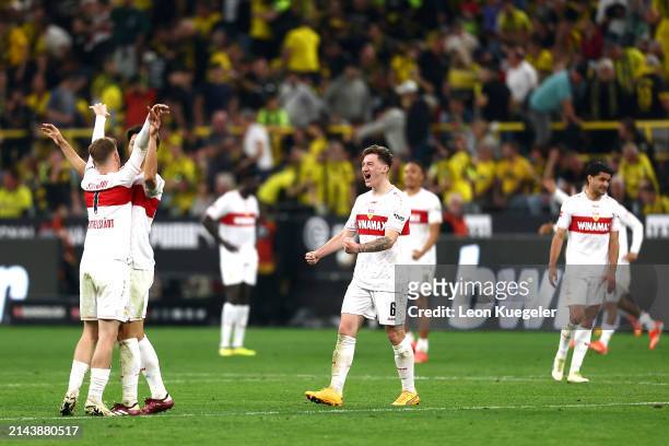 Angelo Stiller of VfB Stuttgart and teammates celebrate following the team's victory during the Bundesliga match between Borussia Dortmund and VfB...