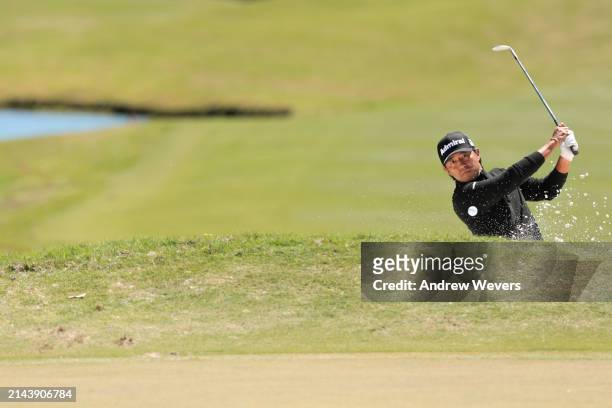 Satoshi Kodaira of Japan plays a shot from a bunker on the 14th hole during the third round of the Club Car Championship at The Landings Golf &...