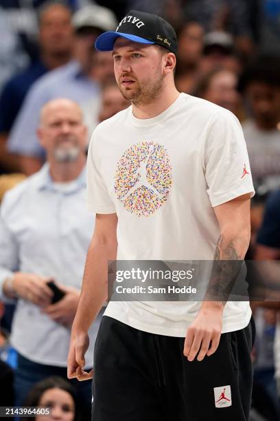 Luka Doncic of the Dallas Mavericks looks on during the second half against the Golden State Warriors at American Airlines Center on April 05, 2024...