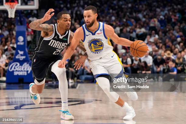 Stephen Curry of the Golden State Warriors is defended by P.J. Washington of the Dallas Mavericks during the second half at American Airlines Center...