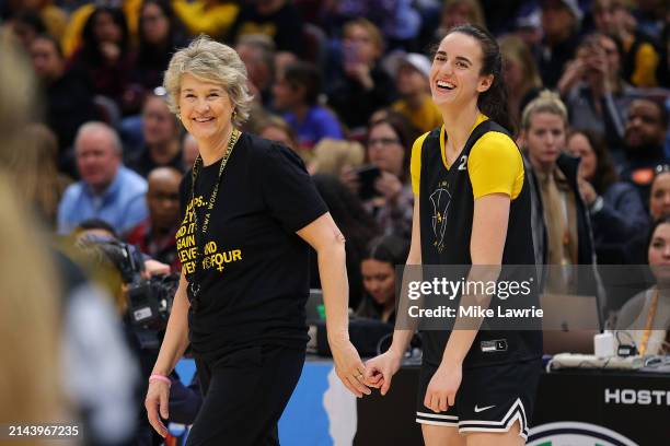 Head coach Lisa Bluder speaks to Caitlin Clark of the Iowa Hawkeyes during an open practice session ahead of the 2024 NCAA Women's Basketball Final...