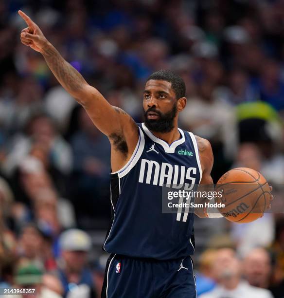 Kyrie Irving of the Dallas Mavericks controls the ball during the first half against the Golden State Warriors at American Airlines Center on April...