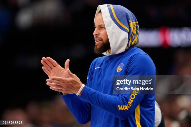 Stephen Curry of the Golden State Warriors reacts during the first half against the Dallas Mavericks at American Airlines Center on April 05, 2024 in...