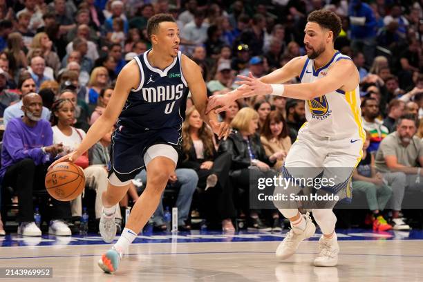 Dante Exum of the Dallas Mavericks is defended by Klay Thompson of the Golden State Warriors during the first half at American Airlines Center on...