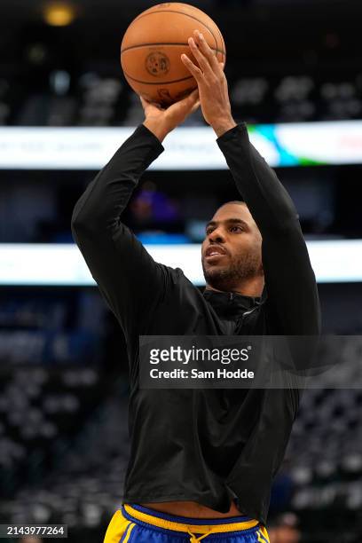 Chris Paul of the Golden State Warriors warms up before the game against the Dallas Mavericks at American Airlines Center on April 05, 2024 in...