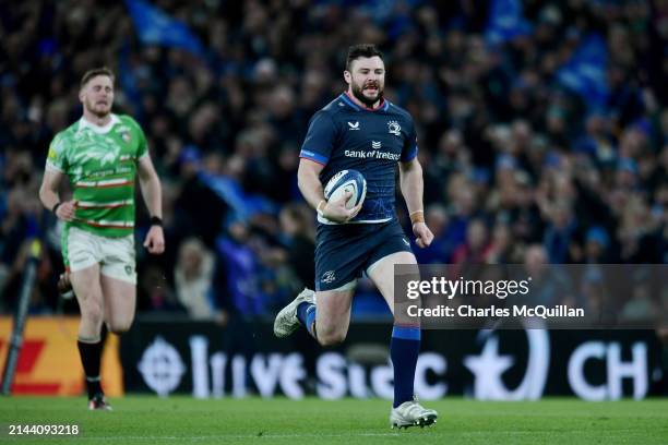 Robbie Henshaw of Leinster Rugby runs to score his team's fourth try during the Investec Champions Cup Round Of 16 match between Leinster Rugby and...