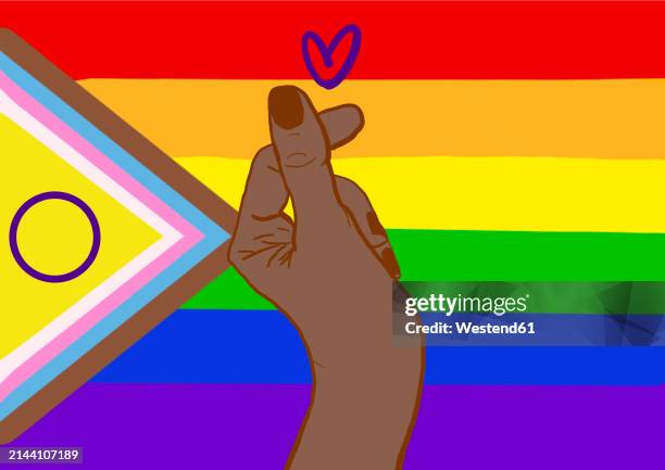 hand of woman making heart shape against rainbow flag - multi colored background stock illustrations