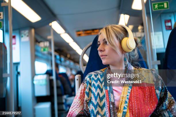 woman with wireless headphones traveling in train - patchwork stock pictures, royalty-free photos & images