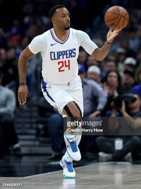 Norman Powell of the LA Clippers dribbles during a 102-100 win over the Denver Nuggets at Crypto.com Arena on April 04, 2024 in Los Angeles,...