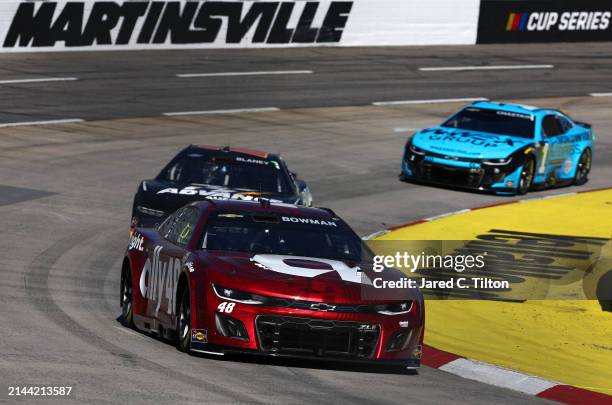 Alex Bowman, driver of the Ally Ruby Chevrolet, Ryan Blaney, driver of the Advance Auto Parts Ford, and Ross Chastain, driver of the Worldwide...