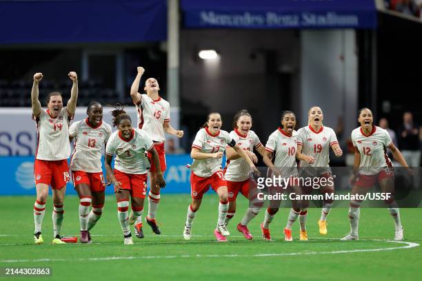 Canada players celebrate after winning a penalty shootout against Brazil in the 2024 SheBelieves Cup at Mercedes-Benz Stadium on April 06, 2024 in...
