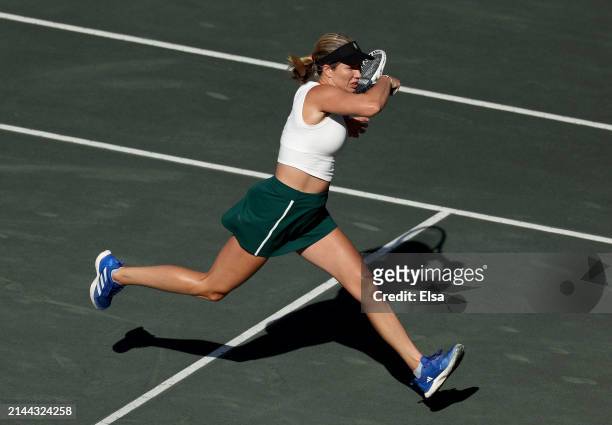 Danielle Collins of the United States returns a shot to Maria Sakkari of Greece in the semifinal match on Day 6 of the WTA 500 Credit One Charleston...