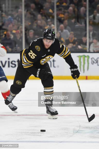 Brandon Carlo of the Boston Bruins skates with the puck against the Florida Panthers at the TD Garden on April 6, 2024 in Boston, Massachusetts.