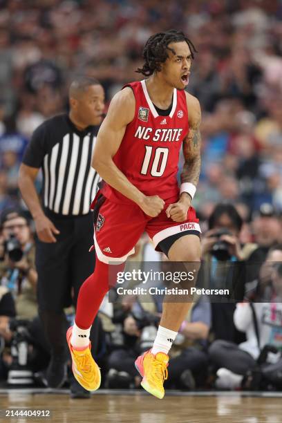 Breon Pass of the North Carolina State Wolfpack celebrates after making a shot in the first half against the Purdue Boilermakers in the NCAA Men's...