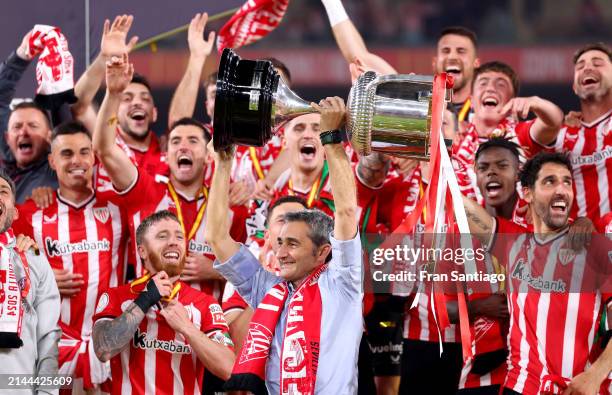 Ernesto Valverde, Head Coach of Athletic Club, lifts the Copa Del Rey trophy in celebration of victory following the Copa Del Rey Final between...