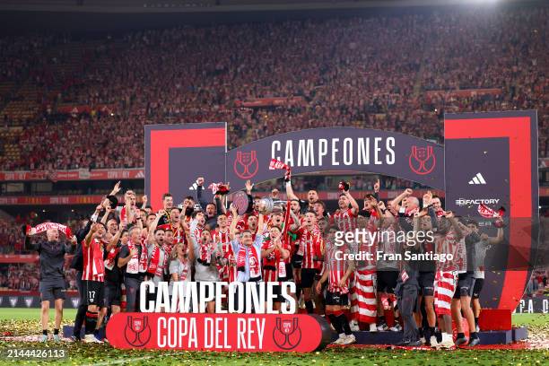 Ernesto Valverde, Head Coach of Athletic Club, lifts the Copa Del Rey trophy in celebration of victory following the Copa Del Rey Final between...